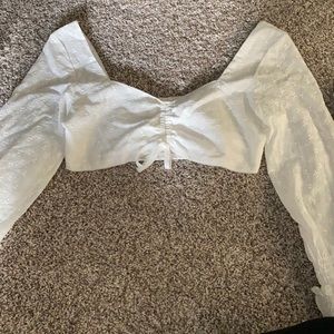 White cropped long sleeve floral top
